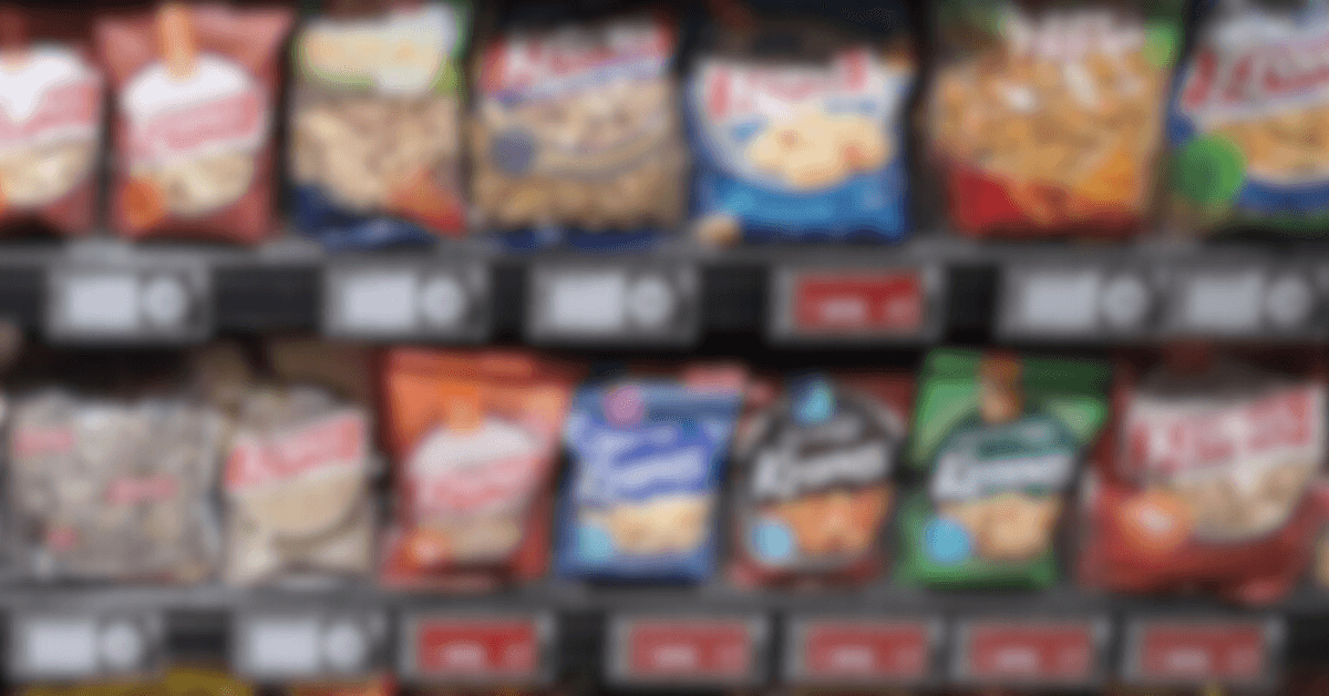 Different packaged snacks on a shelf display